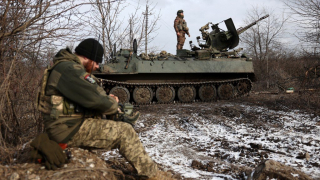 Ukrainian anti-aircraft gunners of the 93rd Separate Mechanized Brigade Kholodny Yar monitor the sky from their positions in the direction of Bakhmut in the Donetsk region, amid the Russian invasion of Ukraine, on February 20, 2024. (Photo by Anatolii STEPANOV / AFP)