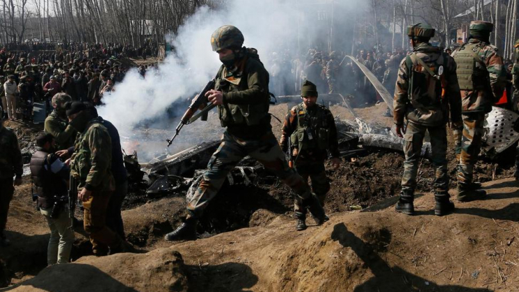 Indian army soldiers arrive near the wreckage of an Indian aircraft after it crashed in Budgam area, outskirts of Srinagar, Indian controlled Kashmir, Wednesday, Feb.27, 2019. AP Photo/Mukhtar Khan